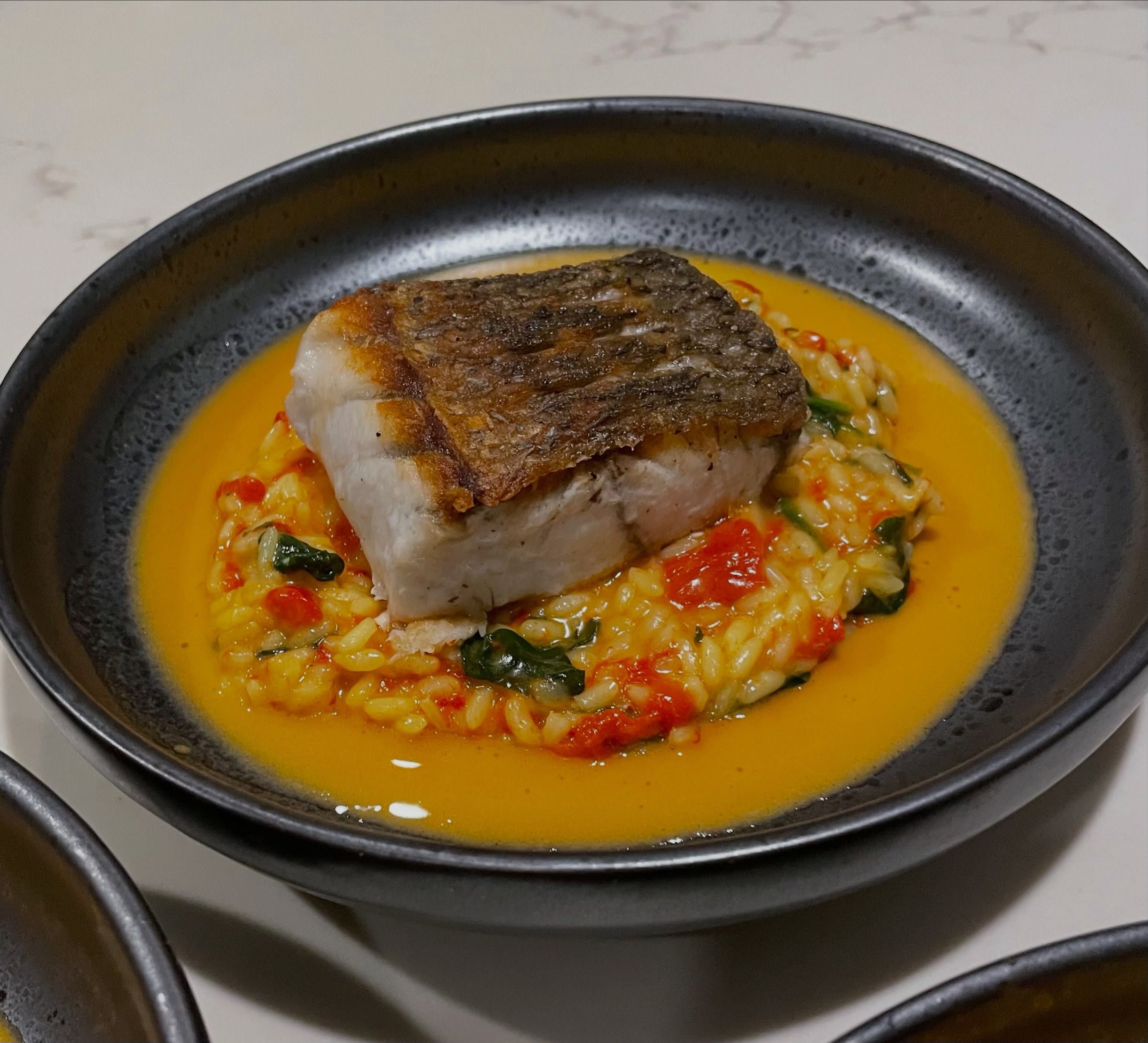 Here is a hearty winter fish dish 😁. Roasted Barramundi Fillet, Capsicum & Saffron Risotto, Tomato Butter. New on the menu 👍